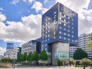 a building with a sign on the side of it at Novotel Paris 17 in Paris