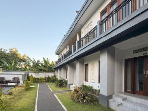a building with a walkway in front of it at The Lavana Pondok JegegBagus near Pandawa Beach in Ungasan