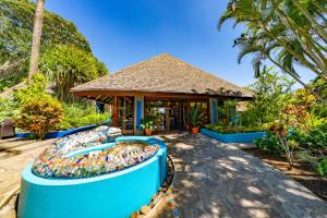 a swimming pool in front of a gazebo at Xandari Resort & Spa in Alajuela