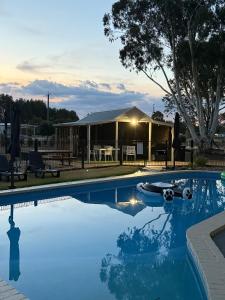 a swimming pool with a boat in the middle at All Seasons Mansfield in Mansfield +29 photos
