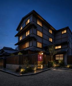 a large black building with many windows at night at シーザー祇園CaesarGion in Kyoto