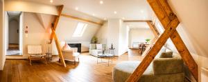 a large living room with a couch and chairs at Ryckevelde in Damme