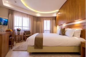 Postel nebo postele na pokoji v ubytování Hotel Ayoub & Spa