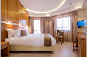 Postel nebo postele na pokoji v ubytování Hotel Ayoub & Spa