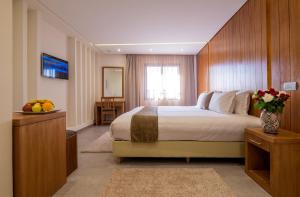 Postel nebo postele na pokoji v ubytování Hotel Ayoub & Spa
