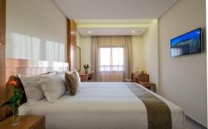 Postel nebo postele na pokoji v ubytování Hotel Ayoub & Spa
