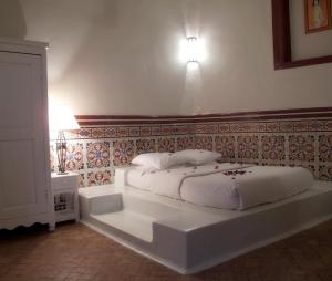 Postel nebo postele na pokoji v ubytování Casa Lila & Spa