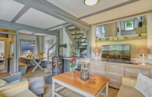 a living room with a table and a dining room at Maier Kirchheim in Kemmerode