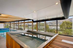 a large swimming pool in a house with a swimming pool at Luxuy Vista in Wanaka