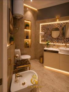 a bathroom with a tub and a sink and a toilet at GA Cairo Hotel Downtown in Cairo