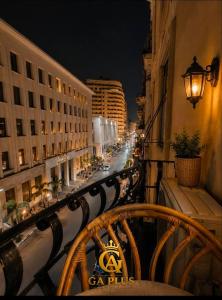 a balcony with a view of a city street at night at GA Cairo Hotel Downtown in Cairo
