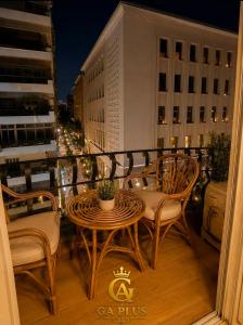 a balcony with a table and chairs on a building at GA Cairo Hotel Downtown in Cairo