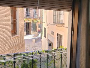 a balcony with a view of a city street at apto La Campana in Toledo