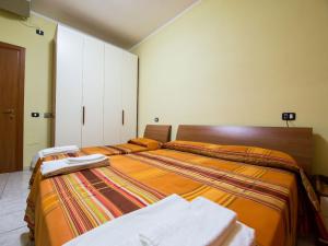 two beds sitting next to each other in a room at Hotel Villaggio S. Antonio in Isola Capo Rizzuto