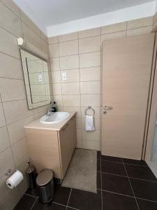 a bathroom with a sink and a mirror at WHTheGardens in Pyla