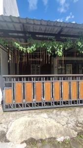 a fence in front of a building at Rumah Senden Guesthouse in Yogyakarta