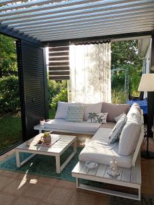 a living room with two couches and a table at La conviviale in Saintes