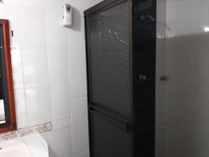 a bathroom with a shower with a toilet and a sink at Hotel Campestre Kosta Azul in Villavicencio +43 photos