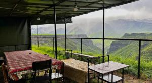 a tent with a table and chairs and a view at Tsatʼer Guest House in Tsatʼer +43 photos