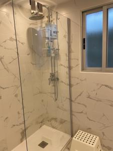 a bathroom with a shower with a glass door at Anna Apartment in Altea