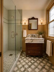 a bathroom with a shower and a sink and a mirror at Simpson House Inn in Santa Barbara +98 photos