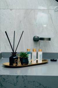 a tray with five bottles of essential oils on a counter at The Gardens in Marracuene +1 photo