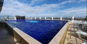 a large swimming pool on top of a building at Kandi Royale Heights in Angeles