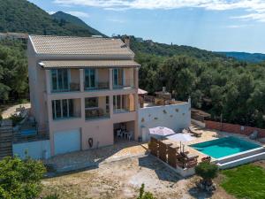 an aerial view of a house with a swimming pool at Villa Sarakinos in Kriniás