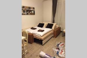 Postel nebo postele na pokoji v ubytování Apartment Argentinská 8
