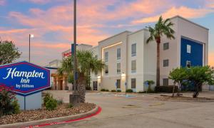 a sign for a hampton inn in front of a building at Hampton Inn Houston-Pearland, TX in Pearland