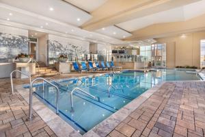 a pool in a hotel with blue water at Hilton Grand Vacations Club Ocean 22 Myrtle Beach in Myrtle Beach