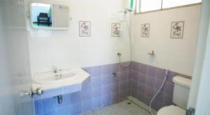 a bathroom with a toilet and a sink at Miami Hotel in Chiang Mai +37 photos