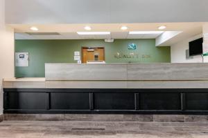 a waiting area at a quality assurance clinic with a reception desk at Quality Inn Cape Girardeau North in Cape Girardeau
