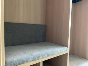 a bench in a corner of a room at AiRom Hotel in Atyrau