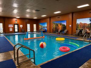 a swimming pool with frisbees in the water at Quality Inn Fort Frances in Fort Frances