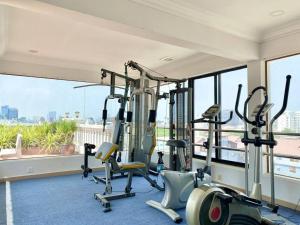 a gym with cardio equipment in a room with a window at WH302 Residence by WH in Phnom Penh