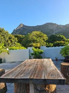 a wooden table with a view of mountains at Kot Ory Mountain View Studio in Moka