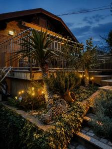 a house with a garden with trees and lights at Holiday home Damian - Private pool in Ðurđekovec