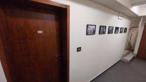 an open door in a room with pictures on the wall at Room 2 in Gotse Delchev