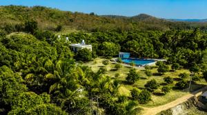 an aerial view of a resort with a pool and trees at Aatman Forest Resort - A Luxury Stay in Sasan Gir in Sasan Gir