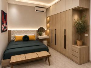 a bedroom with a bed and a cabinet and a sink at Bi Room in Hai Phong