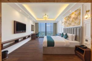 a bedroom with a large bed and a television at Hotel The Bliss Kufri in Kūfrī