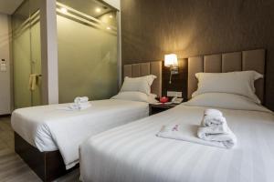 Postel nebo postele na pokoji v ubytování Hotel Trillium