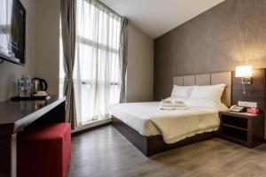 Postel nebo postele na pokoji v ubytování Hotel Trillium