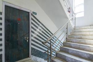 a set of stairs leading up to a door at Via Ayush Villa, Hiland Park in Kolkata