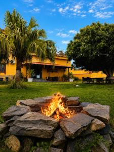 a fire pit in a yard with rocks at Fort Tenerife Gran Casa de Campo in Tacoronte