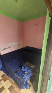 a room with a bed in the corner of a room at Dakshu guest house in Ukhimath