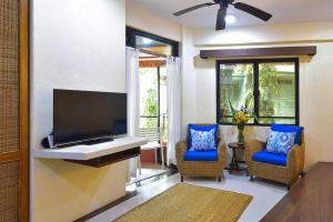 
A television and/or entertainment centre at Punta Rosa Boutique Hotel
