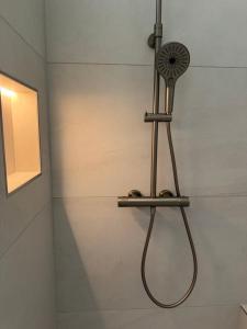 a shower in a bathroom with a shower head at Alte Schmiede in Sundern +2 photos