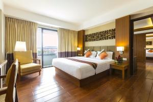 Ліжко або ліжка в номері Asia Hotels Group (Poonpetch Chiangmai)